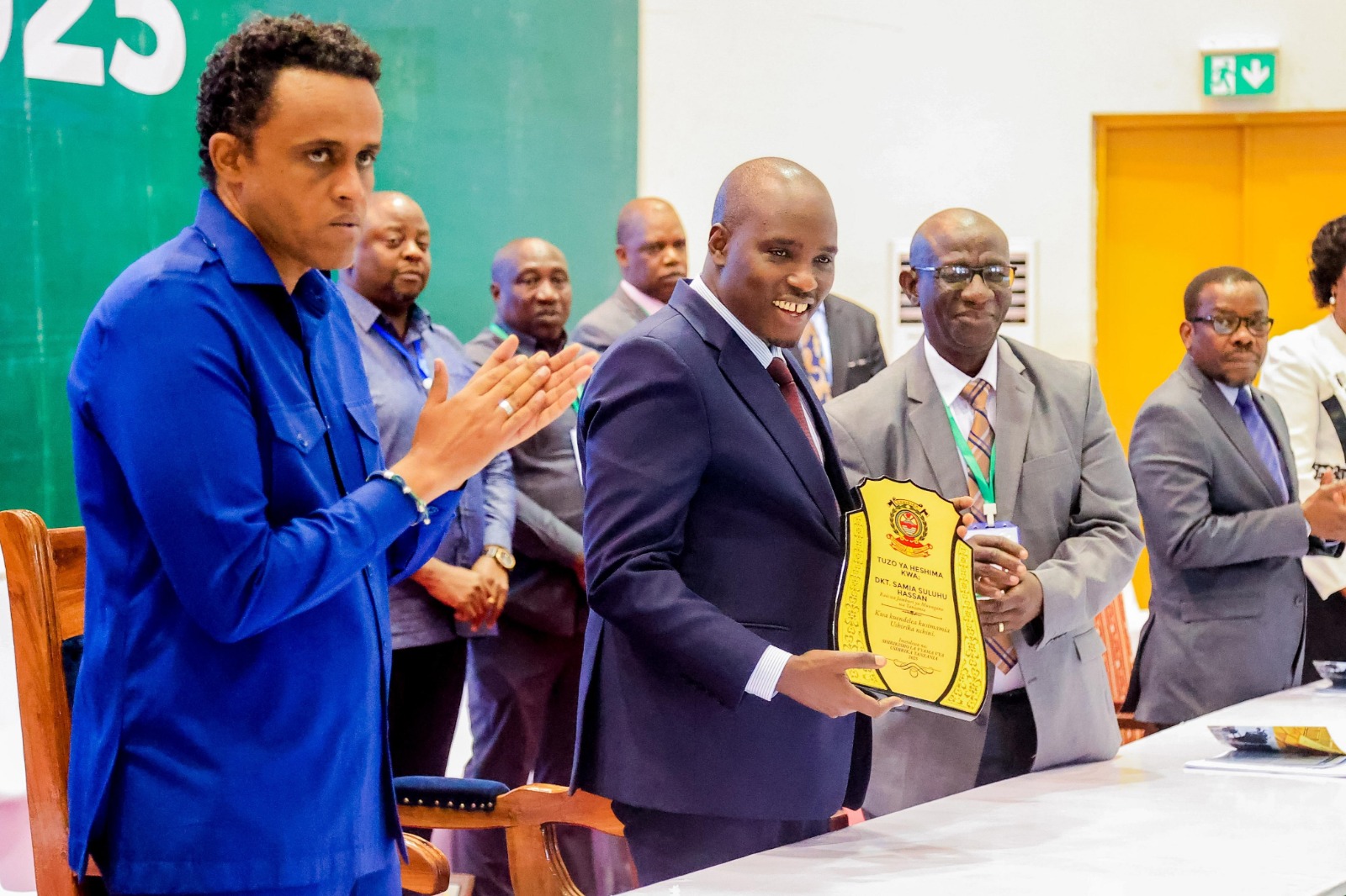 Deputy Prime Minister and Energy minister Dr Doto Biteko receives an honorary award on behalf of President Samia Suluhu Hassan, to whom it was presented in appreciation of her continued support to cooperatives in the country. 